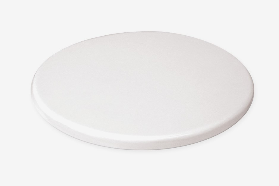 A plain, round, white ceramic plate is shown against a white background.