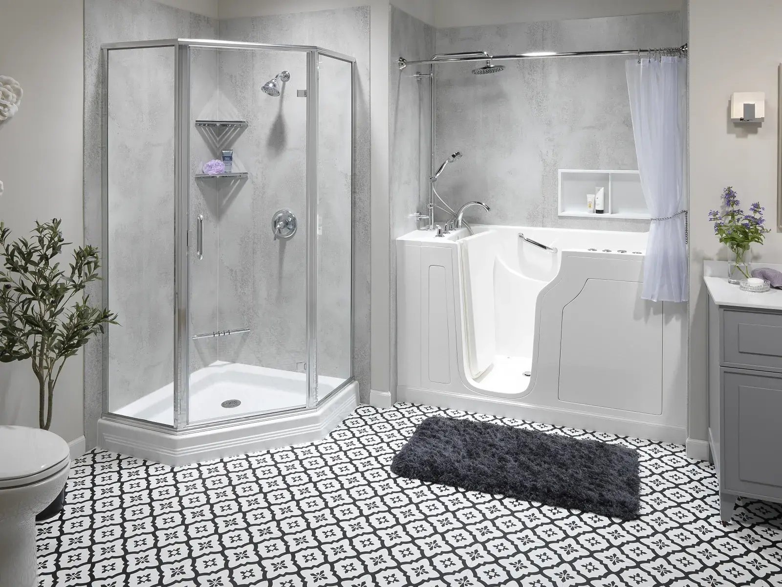 Bathroom with walk-in white tub, glass shower, patterned floor tile, gray walls, and gray vanity.