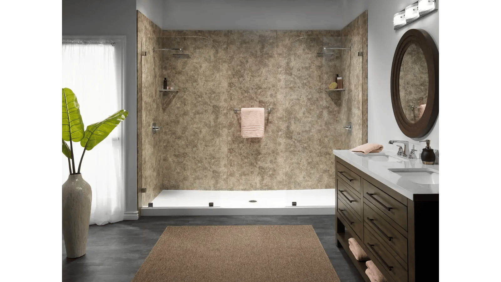 Modern bathroom with brown marble-look shower, white shower base, vanity with oval mirror, and houseplant against a window.